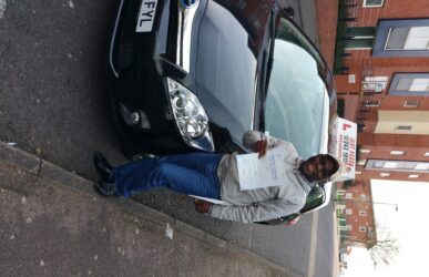 A man with driving test pass certificate