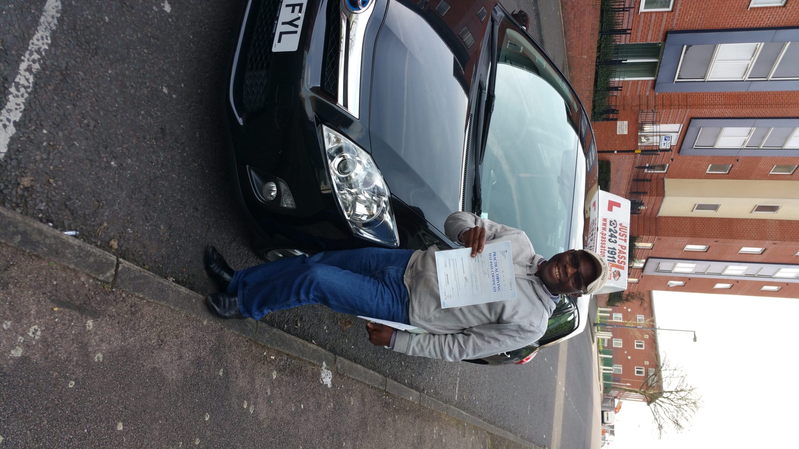 A man with driving test pass certificate